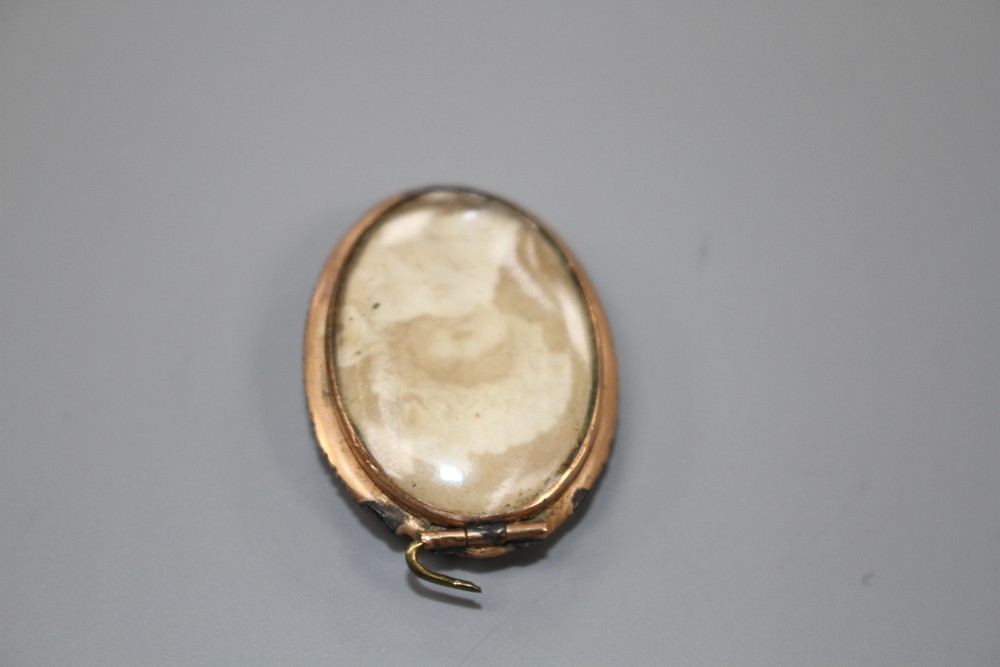 A George V 18ct gold and graduated five stone diamond ring and a 19ct century locket(a.f.).